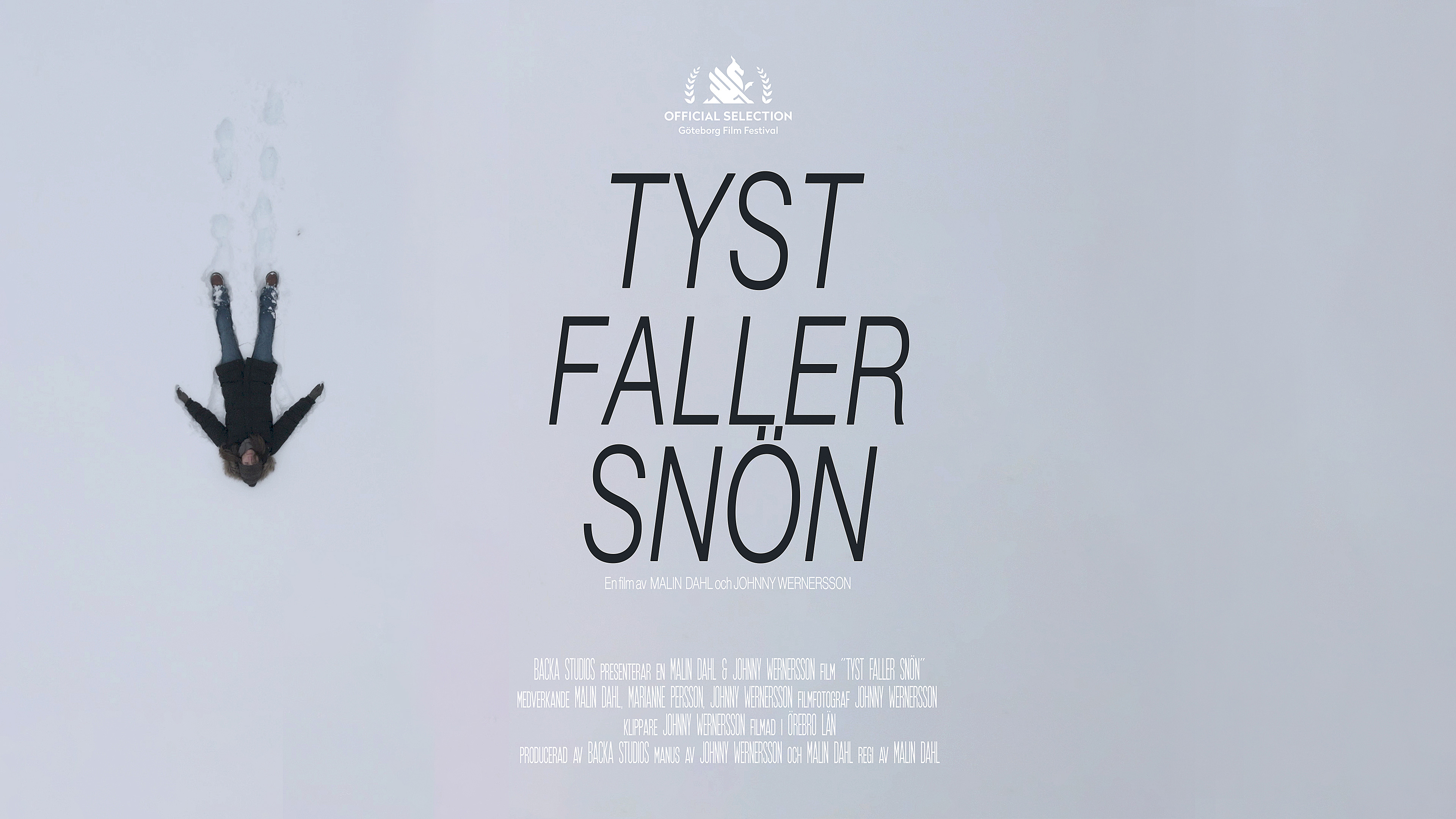 Filmaffisch Tyst faller snön, en person som gör en snöängel.